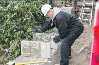  ?? ALEX SCHULDTZ/THE HOLMES GROUP ?? A retaining wall may seem like a small project, but it provides key protection to the landscape around your home. They must be built right and maintained to keep the property protected.