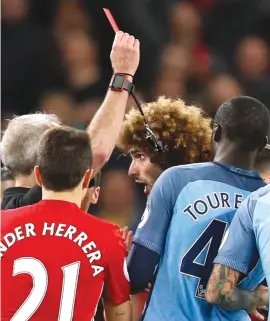  ?? Picture: Reuters ?? RED-HANDED. Manchester United’s Marouane Fellaini plays innocent after being handed his second yellow card during their Premier League game against Manchester City at the Etihad Stadium last night.