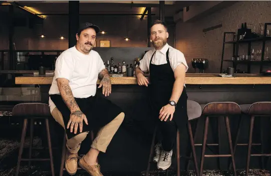  ?? PHOTOS: ALLEN McINNIS ?? Le Mousso chef Antonin Mousseau-Rivard, left, passes control of Le Petit Mousso’s kitchen to Benjamin Mauroy-Langlais.