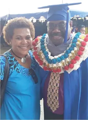  ?? Photo: Tudravu family ?? Police Chief of Operations Assistant Commission­er Rusiate Tudravu (right) with proud wife Silina Tudravu at the Fiji National University graduation ceremony at the Vodafone Arena in Suva on Wednesday.