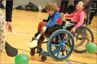  ??  ?? Children having fun playing Indoor hurling at the Sports Ability Day.