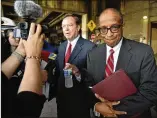  ?? HYOSUB SHIN / AJC ?? Elvin “E.R.” Mitchell Jr. (right) stands with his attorney, Craig Gillen, as Gillen speaks to members of the press outside the federal courthouse in Atlanta on Tuesday.