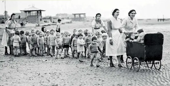  ??  ?? BELOW London’s Blitzed babies enjoying the peace and safety of the West Country seaside