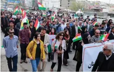  ?? AFP ?? Protesters march in Sulaymaniy­ah, in the Kurdistan region, after a drone strike near the city’s airport this month