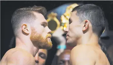  ?? AFP ?? El mexicano Saúl ‘Canelo’ Álvarez y el kazajo Gennady Golovkin en el cara a cara tras el pesaje de ayer.