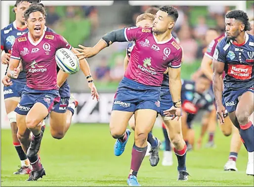  ?? Picture: REDS ?? Queensland Reds’ Hunter Paisami gets an off-load away against the Melbourne Rebels on the weekend.