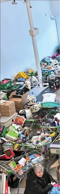  ??  ?? SWAMPED: By 10am yesterday, this branch of Asda in Clapham, South West London, was not only teeming with shoppers but was piled high at the back of the store with online orders waiting to be picked up or delivered to worried customers