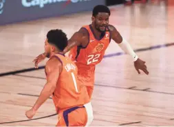  ?? KIM KLEMENT/USA TODAY SPORTS ?? Suns center Deandre Ayton (22) and guard Devin Booker are two of the team’s key pieces heading into next season.