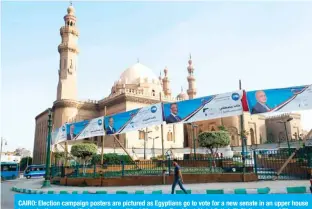  ??  ?? CAIRO: Election campaign posters are pictured as Egyptians go to vote for a new senate in an upper house in an election seen unlikely to revive political life under President Abdel Fattah El-Sisi’s rule. — AFP