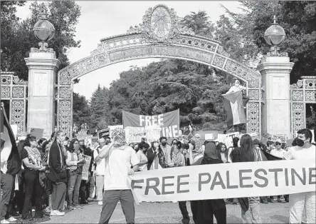  ?? MICHAEL LIEDTKE Associated Press ?? PROTESTERS at UC Berkeley show their support for Palestinia­ns in October. In the Bay Area, city leaders in San Francisco and Oakland have adopted resolution­s calling for a cease-fire in the Israel-Hamas war, but the Berkeley City Council has resisted taking up the issue.