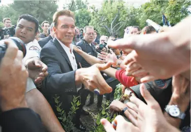  ?? Michael Macor / The Chronicle 2003 ?? Arnold Schwarzene­gger campaigns in Burbank in August 2003 during his first public appearance after announcing his run for governor. His candidacy undermined thenGov. Gray Davis’ attack on the GOP.
