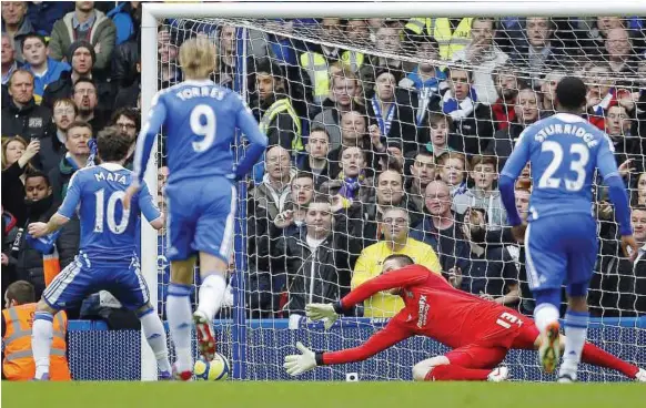  ??  ?? Spot of bother: Chelsea’s Juan Mata sees his penalty saved by Birmingham goalkeeper Colin Doyle during their FA Cup fifth round match at Stamford Bridge yesterday. The match ended 1-1. — AFP