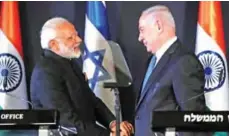  ??  ?? JERUSALEM: Indian Prime Minister Narendra Modi (L) shakes with his Israeli counterpar­t Benjamin Netanyahu during a press conference. — AFP