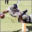  ??  ?? Baltimore Ravens wide receiver Vince Mayle (88) scores a touchdown past Oakland Raiders strong safety Keith McGill II during the first half of an NFL football game in Oakland, California
on Oct 8. (AP)