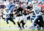  ?? AP PHOTO BY MARK ZALESKI ?? Oakland Raiders running back Marshawn Lynch (24) runs the ball against the Tennessee Titans in the second half of an NFL football game Sunday, in Nashville, Tenn.