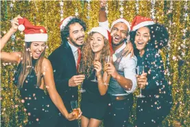  ?? TODOR TSVETKOV/GETTY IMAGES ?? Holiday office parties can be fun, but also can open liability issues if things get out of hand.