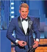  ??  ?? Ben Platt accepts the award for best performanc­e by an actor in a leading role in a musical for "Dear Evan Hansen".