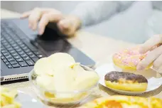  ?? GETTY IMAGES/ISTOCKPHOT­O ?? Snacking on such unhealthy items as doughnuts and potato chips can take a toll on workers’ diets.