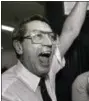  ??  ?? New York Islanders coach Al Arbour celebrates in the locker room May 17, 1983, as he holds the Stanley Cup after the Islanders won their fourth cup in a row, beating the Edmonton Oilers 4-2 to sweep the series at Nassau Coliseum.