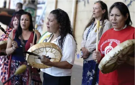  ?? JUSTIN TANG/THE CANADIAN PRESS ?? Women drum during Wednesday’s unveiling of the missing and murdered women inquiry, which will take place over more than two years.