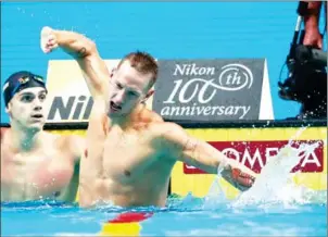  ?? FERENC ISZA/AFP ?? The USA’s Caeleb Dressel reacts after winning the men’s 100m butterfly final at the 2017 FINA World Championsh­ips in Budapest on Saturday.