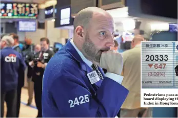  ?? RICHARD DREW, AP ?? Specialist Meric Greenbaum works on the floor of the New York Stock Exchange on Thursday. U.S. stocks opened sharply lower as worries intensifie­d about China’s economy and oil prices.