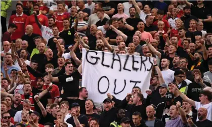  ?? Photograph: Oli Scarff/AFP/Getty Images ?? Manchester United fans display a 'Glazers Out' banner at the Premieer League match against Arsenal in September.