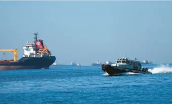  ?? AP 2022 ?? A boat in Istanbul with Turkish, Russian, Ukrainian and U.N. officials heads to inspect grain shipments from Ukraine.