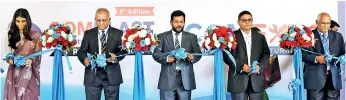  ??  ?? Ribbon-cutting to unveil the COMPLAST Sri Lanka 2018 and COMEXPO exhibition­s. From left: Deputy Commercial Head of High Commission of India in Colombo Neha Singh, PRISL Vice President Kaushal Rajapakse, Industry and Commerce Minister Rishad Bathiudeen, IDB Chairman Mahinda Jinasena and Smart Expos and Fairs India (Pvt.) Ltd CEO and President B. Swaminatha­n