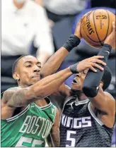  ??  ?? De'Aaron Fox (5) of the Sacramento Kings is fouled by Jeff Teague (55) of the Boston Celtics at Golden 1 Center in Sacramento, California, on Wednesday