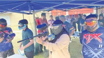  ?? UPMKB — Photo via Facebook/ ?? A participan­t exhibits her shooting skills during the paintball event held by UPM Bintulu.