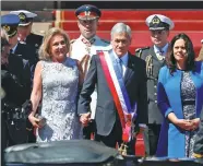  ?? PABLO VERA LISPERGUER / AGENCE FRANCE-PRESSE ?? Chile’s new President Sebastian Pinera and his wife Cecilia Morel leave the Congress in Valparaiso, Chile, after his inaugurati­on ceremony on Sunday. Pinera was sworn in as leader for the second time. Chinese President Xi Jinping’s special envoy Ma...
