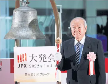  ?? REUTERS ?? Japan’s Finance Minister Shunichi Suzuki prepares to ring a bell during a ceremony marking the open of trading in 2022 at the Tokyo Stock Exchange yesterday.