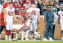  ?? TERRY/ THE OKLAHOMAN] ?? OU's Justin Broiles (25) runs back an intercepti­on during last year's spring football game at Owen Field in Norman. [BRYAN