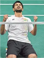  ?? B. Sai Praneeth reacts after beating Lee Dong Keun on Saturday. Praneeth won 21-6, 21-8. — AFP ??