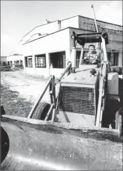  ?? By Al Kaplan via Barry University ?? College president: Sister Jeanne O’Laughlin takes the wheel of a bulldozer in August 1990 at Barry University in Miami.