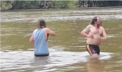  ?? Picture: Supplied ?? Two men were filmed wading waist deep in the Jardine River, with the video posted to social media, accompanie­d by the song Dumb Ways To Die.