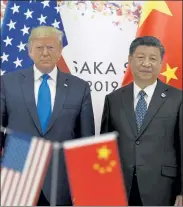  ?? SUSAN WALSH / AP ?? President Donald Trump, left, poses for a photo with Chinese President Xi Jinping during a meeting on the sidelines of the G-20 summit in Osaka, Japan, on June 29.