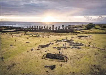  ?? JOSH HANER/THE NEW YORK TIMES ?? The United Nations has said that Easter Island’s ancient artifacts, like statues in Tongariki, may be wiped out. In 2017, more than 100,000 visitors came to see the relics.