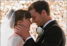  ?? UNIVERSAL PICTURES ?? Dakota Johnson and Jaime Dornan star in “Fifty Shades Freed,” the final chapter in the Christian Grey and Anastasia Steele saga.