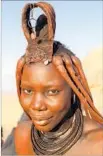  ??  ?? A YOUNG Himba woman in Namibia with traditiona­l ocher-coated dreadlocks.