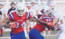  ?? GREG SORBER/ JOURNAL ?? West Mesa’s Joseph Thompson (34) runs for a touchdown as teammate Dakoda Chavez (45) throws a key block Thursday.