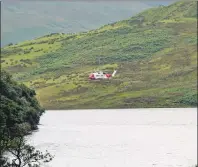  ?? Photograph: Kevin McGlynn ?? The Coastguard helicopter at the scene of the accident last Wednesday afternoon.