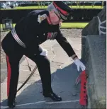  ??  ?? Argyll and Bute’s Lord Lieutenant Patrick Stewart laying a wreath at the Campbeltow­n war memorial to mark the Battle of Loos.