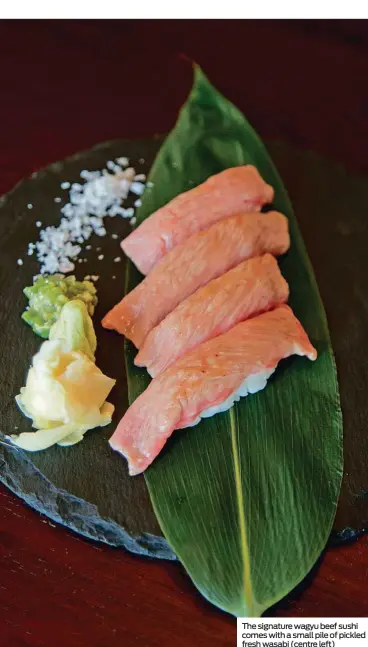  ??  ?? The signature wagyu beef sushi comes with a small pile of pickled fresh wasabi (centre left)