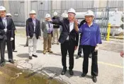  ?? JENNIFER MCDERMOTT AP ?? U.S. Energy Secretary Jennifer Granholm (right) tours the Millstone Nuclear Power Station on Friday.
