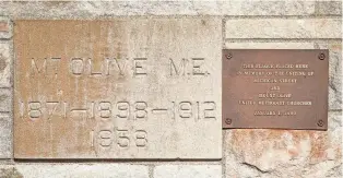  ?? ?? A cornerston­e reads “Mt. Olive M.E. 1871-1898-1912 1958” and “This Plaque Placed Here in memory of the uniting of Michigan Street and Mount Olive United Methodist Churches, Jan. 1, 1990” at Mount Olive United Methodist Church.