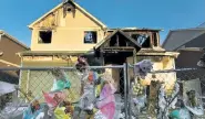  ?? Helen H. Richardson, The Denver Post ?? The burned home of the Diol family is still fenced; it stands burned with old bouquets, stuffed animals and other remembranc­es on Wednesday in Denver. Two 16-year-old boys and one 15-year-old boy were arrested Wednesday morning in Jefferson County, police said.