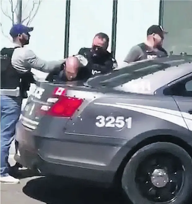  ?? TWITTER ?? The alleged driver of a white van that struck multiple pedestrian­s is taken into custody by Toronto police.