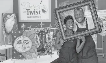  ?? Jerry Baker ?? Painting with a Twist franchise owners Kermie, left, and Algy Irvin, show off their Kingwood studio on FM 1960 East. The couple left New Orleans after Katrina and became successful business owners in Texas, with wine-friendly art classes in Kingwood...